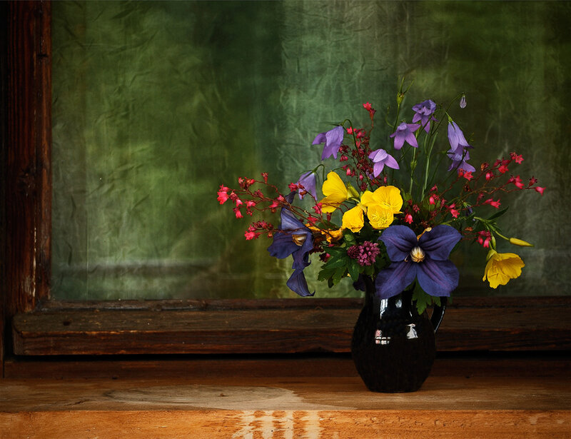 Flowers in a vase by window