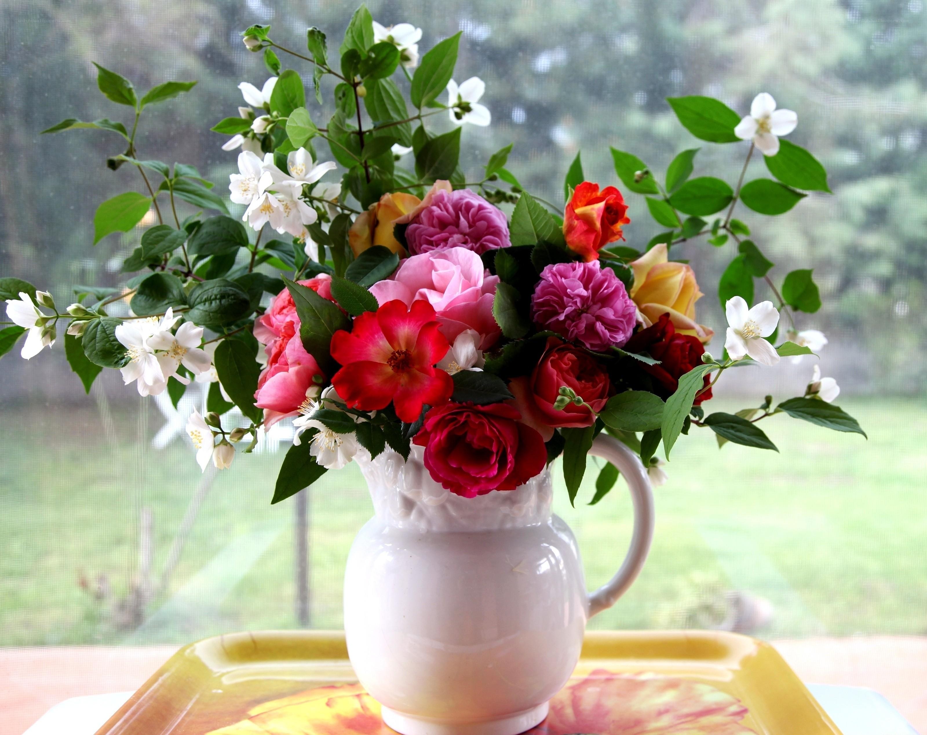 Flowers in a white pitcher