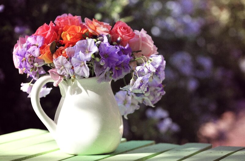 Flowers in a white pitcher