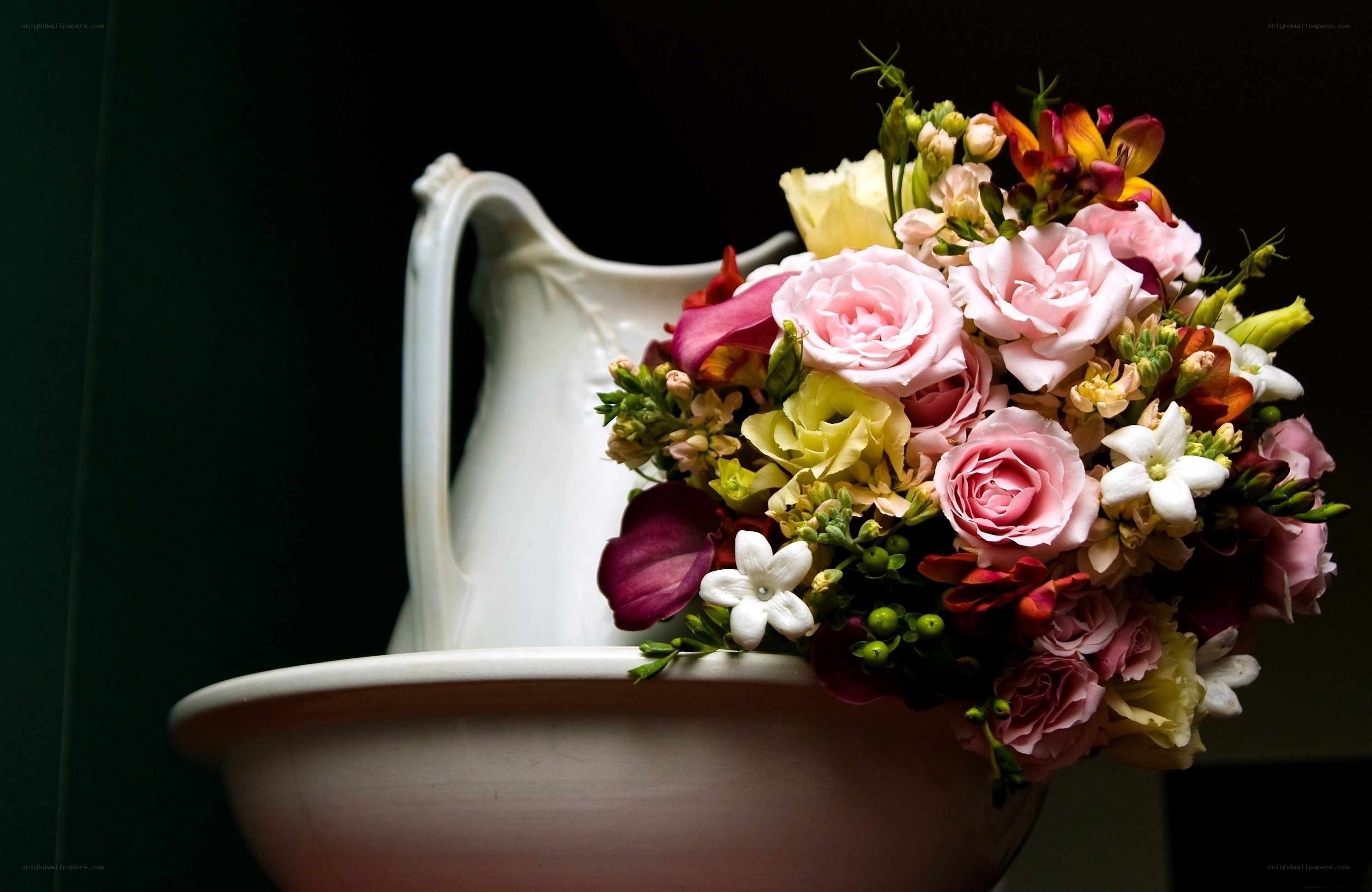 Flowers in a white pitcher