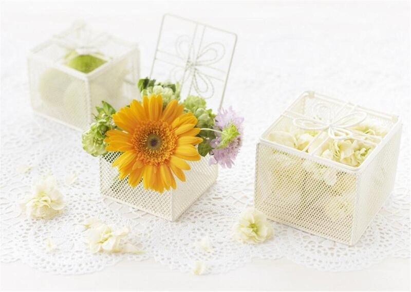 Flowers in white mesh boxes