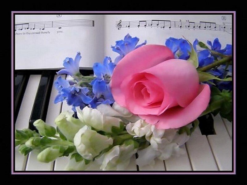 Flowers on a piano with sheet music