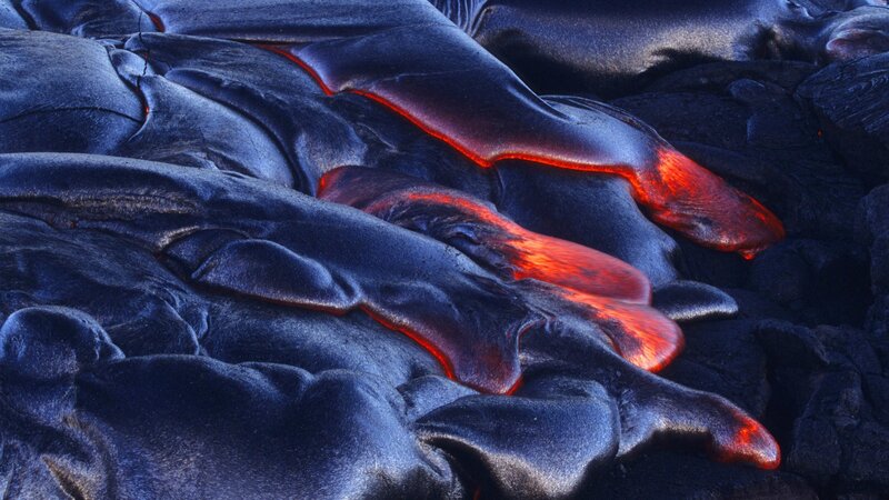 Flowing lava under dark crust