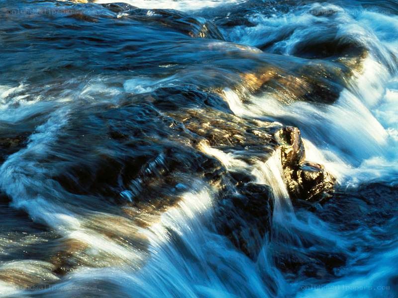 Flowing river over rocks