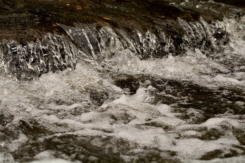Flowing Water over Rocks — Black, Dynamic