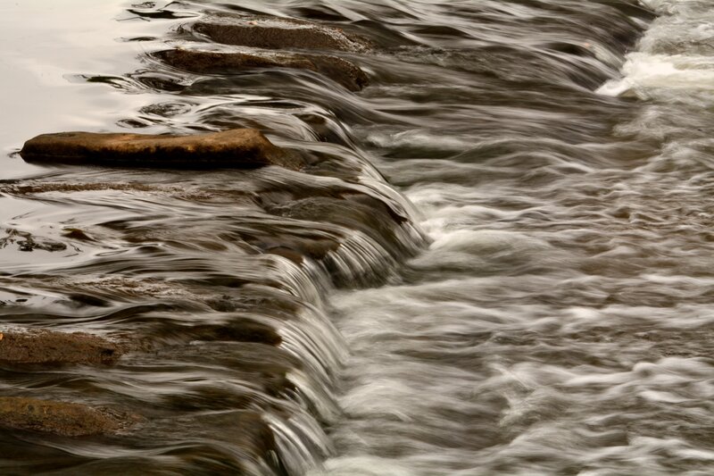 Flowing Water over Rocks — Brown