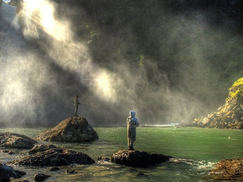 Fly fishing by a waterfall