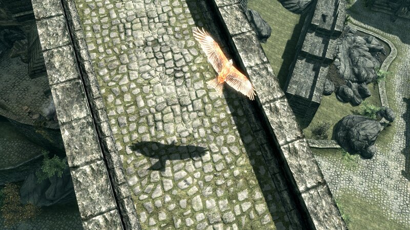 flying bird over stone bridge