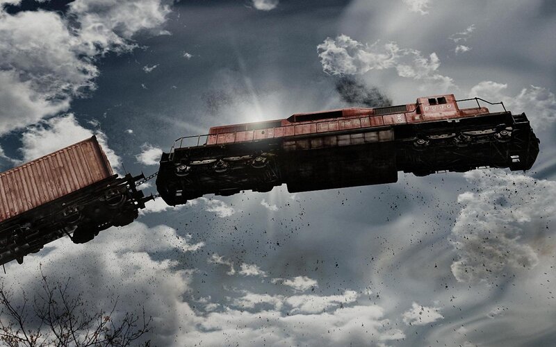 Flying train in stormy sky