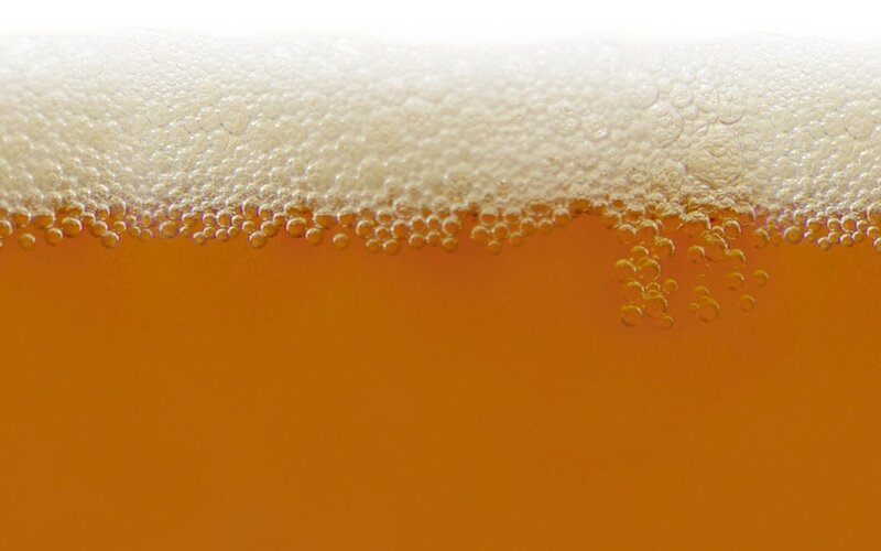 foamy beer head close-up