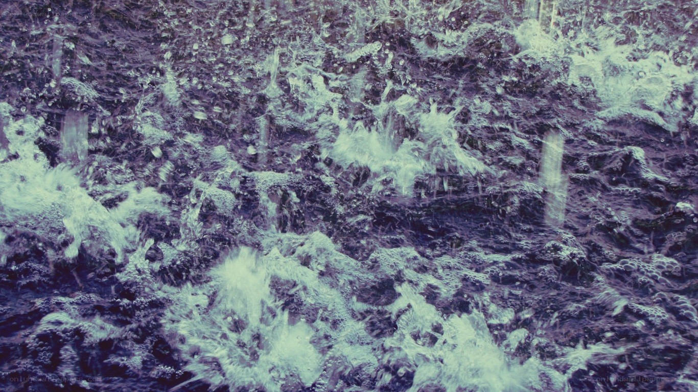 foamy water on dark surface