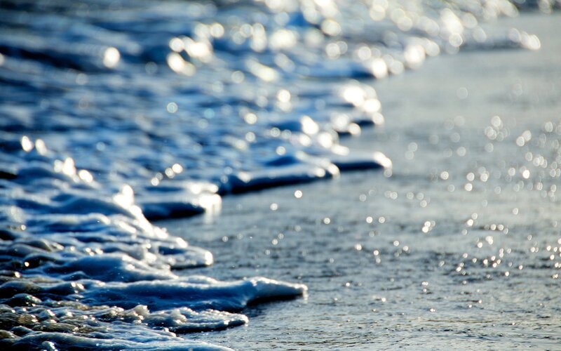 foamy waves on a beach