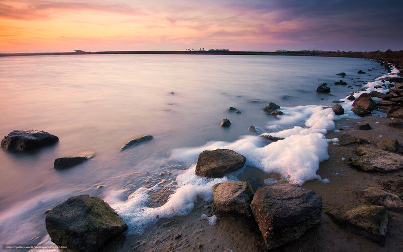 Foamy Waves on Rocky Shore — Orange