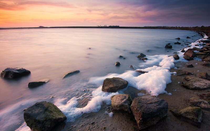 Foamy Waves on Rocky Shore — Pink
