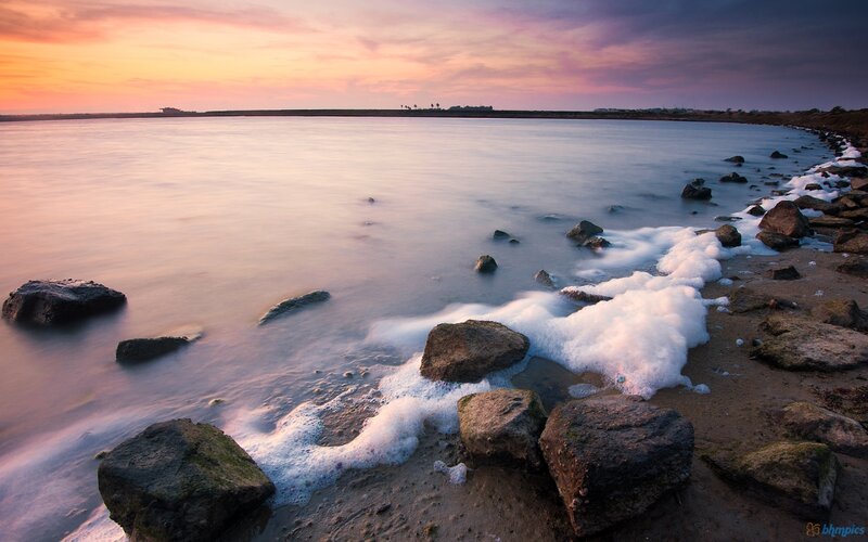 Foamy Waves on Rocky Shore