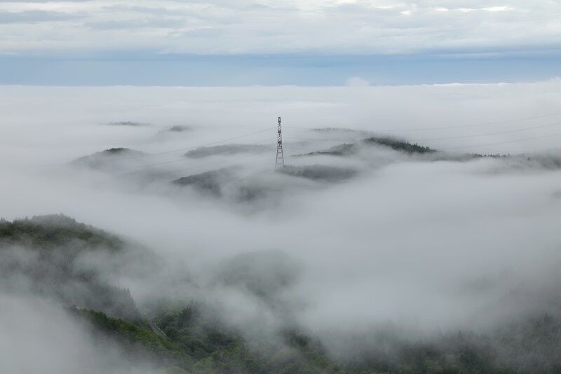 Fog-covered Hills with Tower