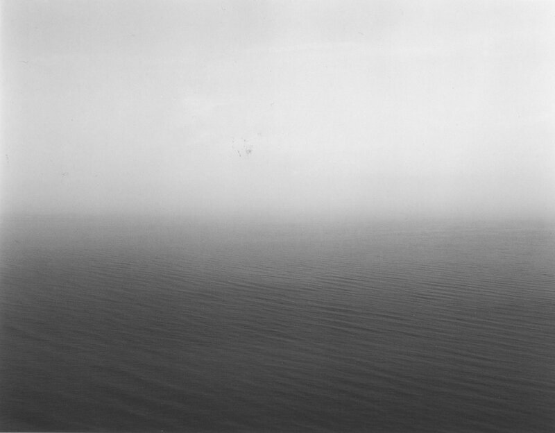 Fog over calm water