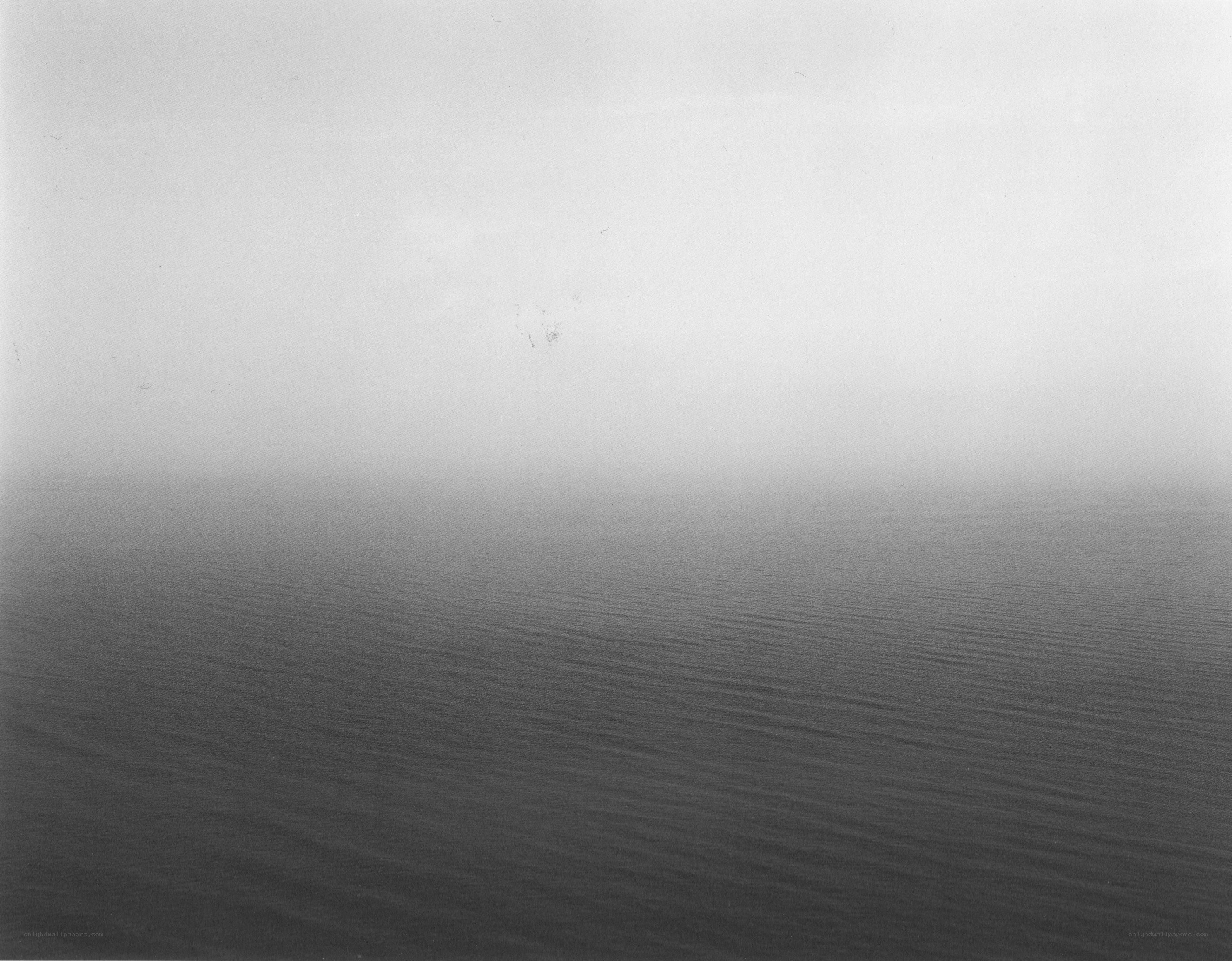 Fog over calm water