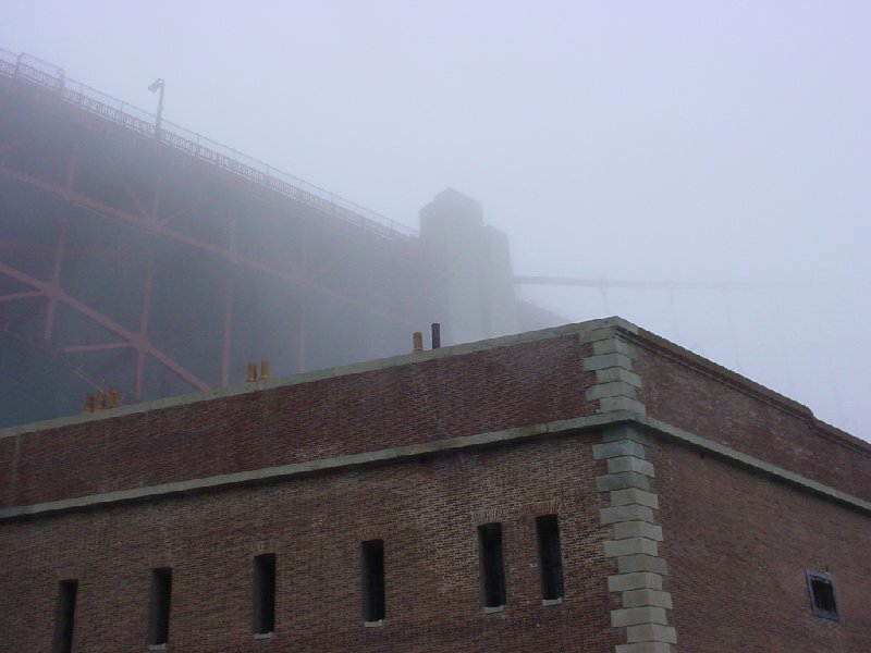 Foggy bridge and brick building