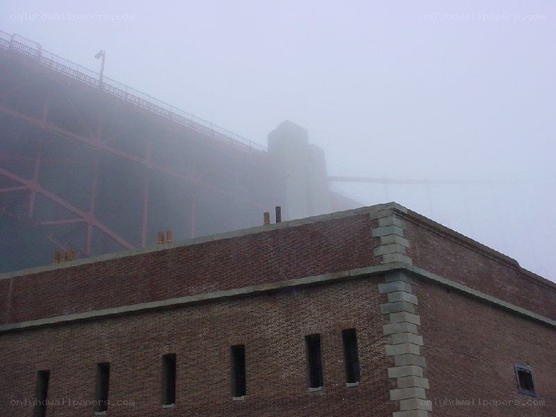 Foggy bridge and brick building