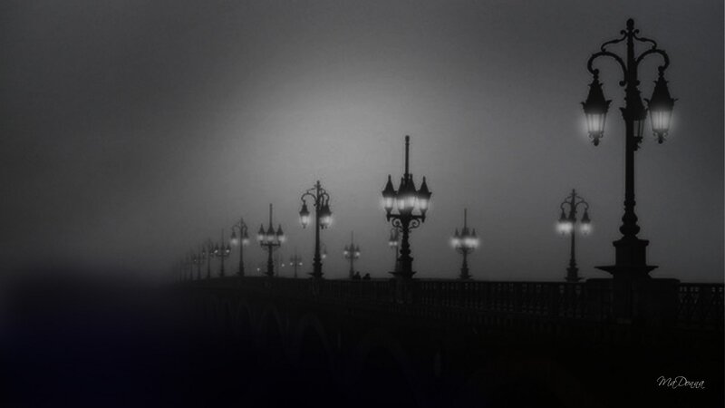 Foggy bridge at night