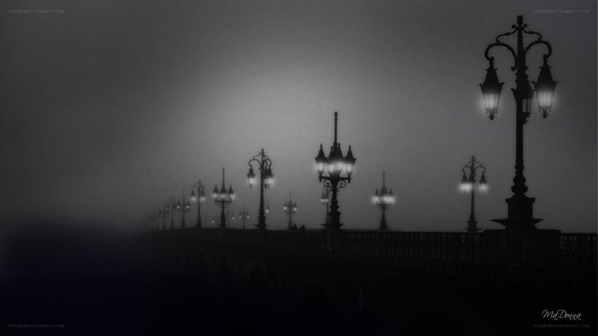 Foggy bridge at night