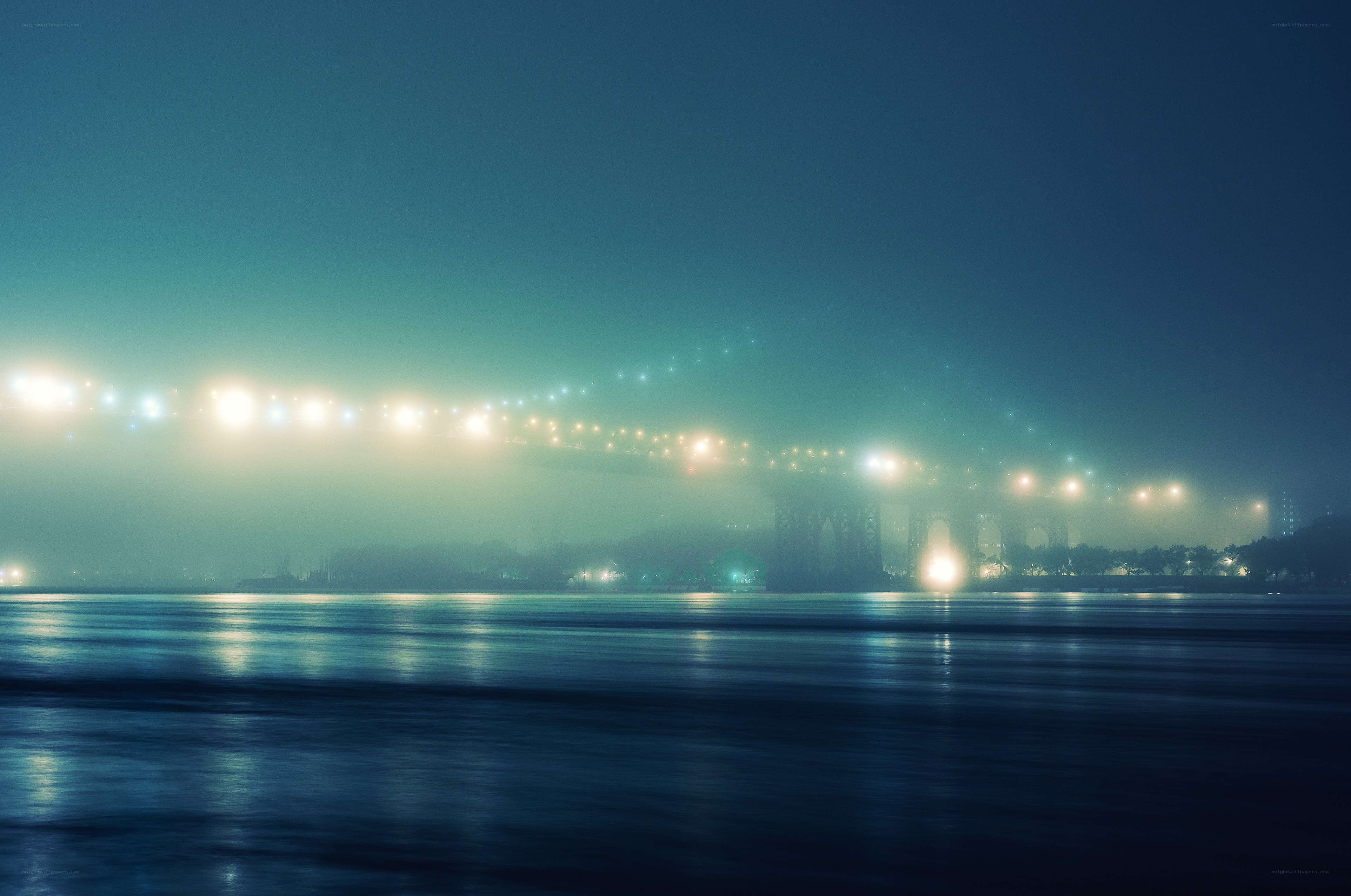 Foggy bridge at night