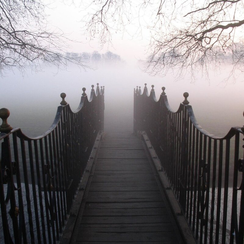 Foggy bridge in misty morning