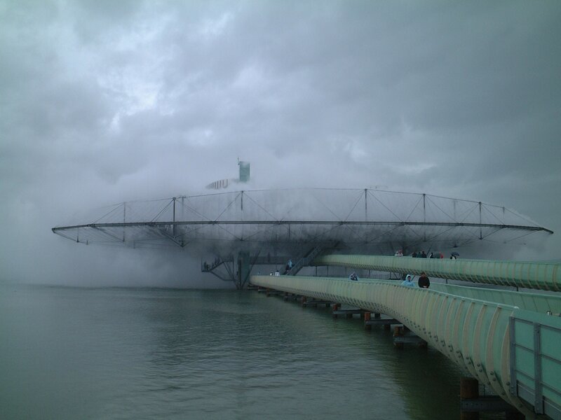 Foggy bridge over water