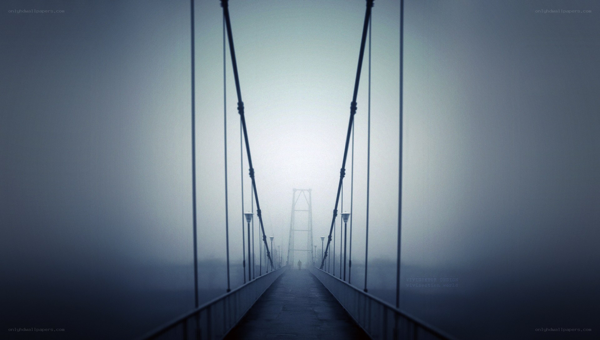 Foggy bridge with lone figure