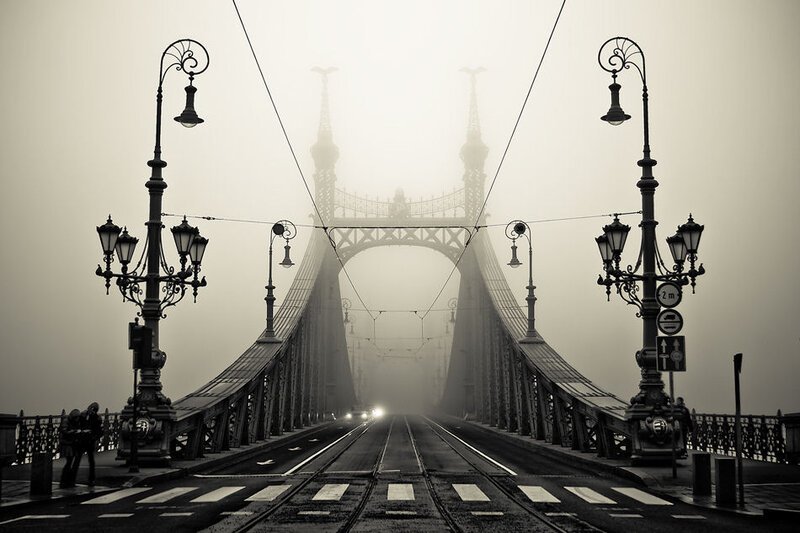 Foggy bridge with tram tracks