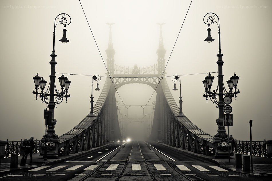 Foggy bridge with tram tracks