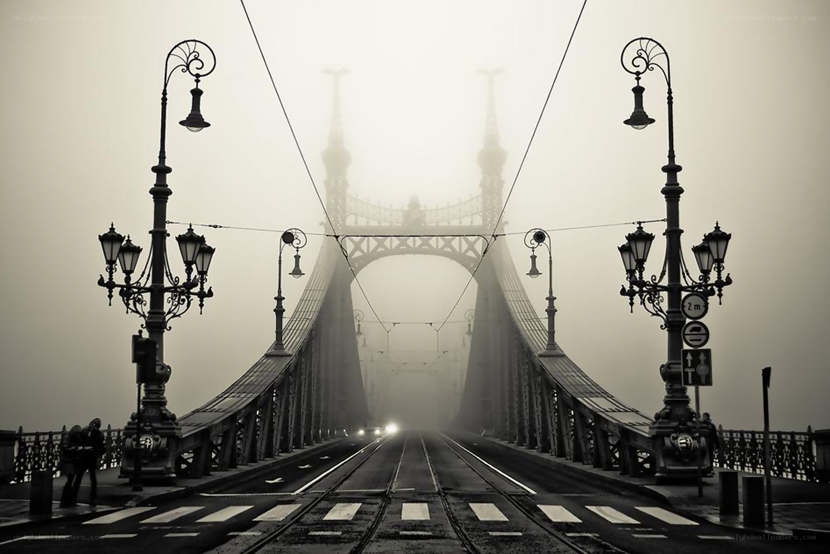 Foggy bridge with tram tracks