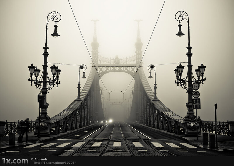 Foggy bridge with tram tracks