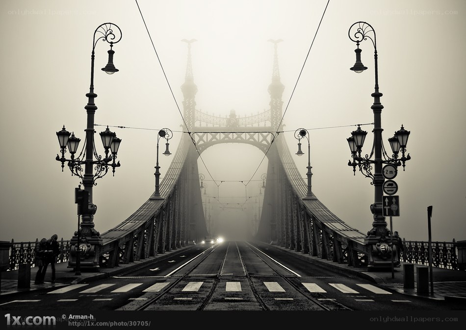 Foggy bridge with tram tracks