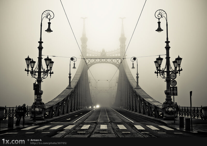 Foggy bridge with tram tracks