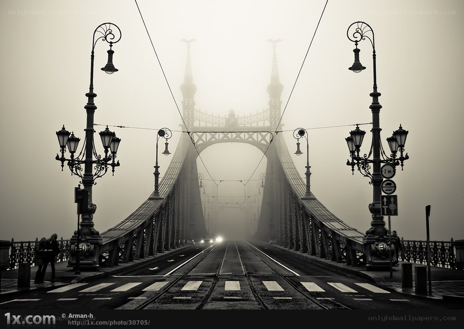 Foggy bridge with tram tracks
