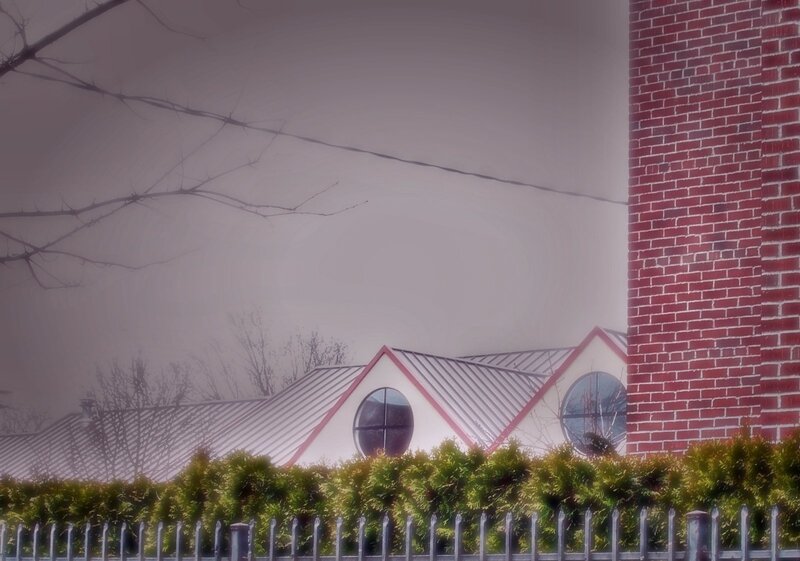 Foggy building with brick wall