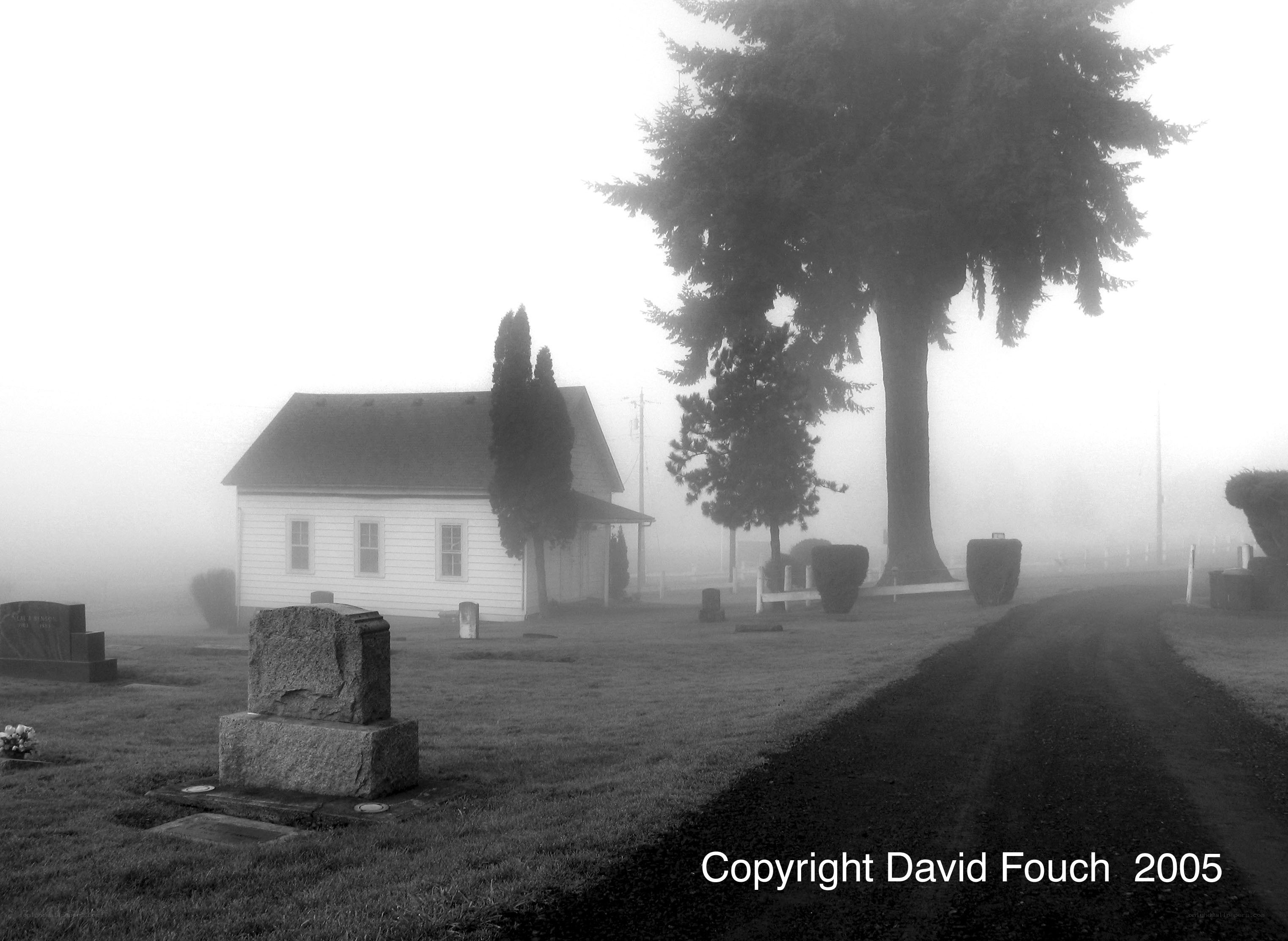 Foggy cemetery with chapel