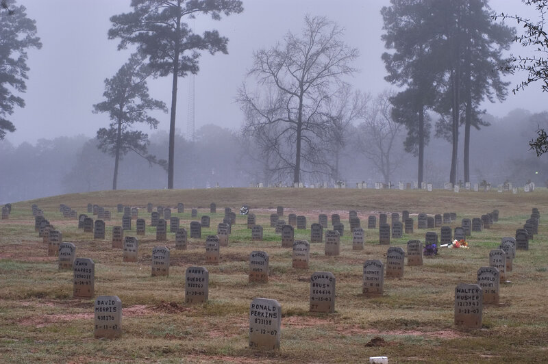Foggy cemetery with gravestones