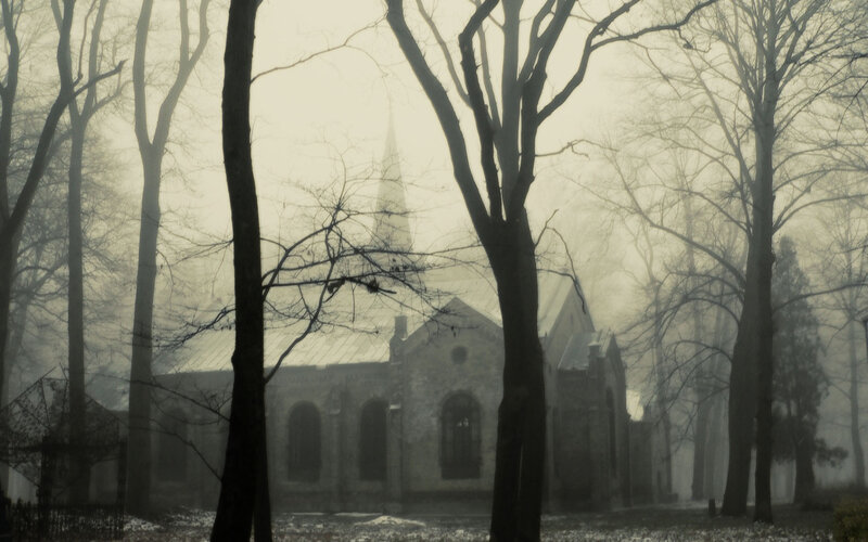Foggy church in winter