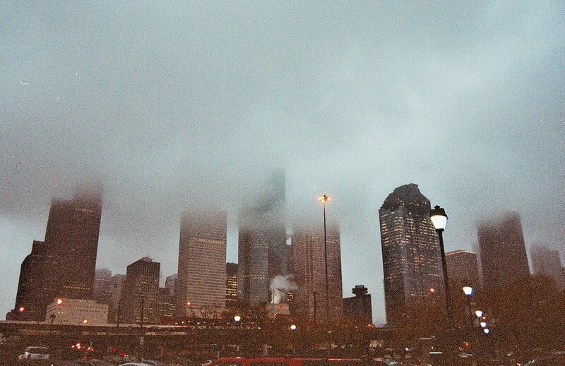 foggy city skyline at dusk