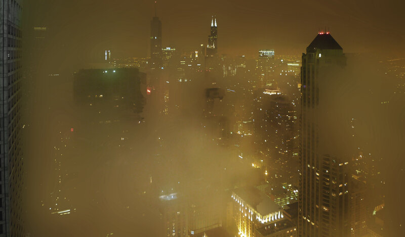 foggy city skyline at night