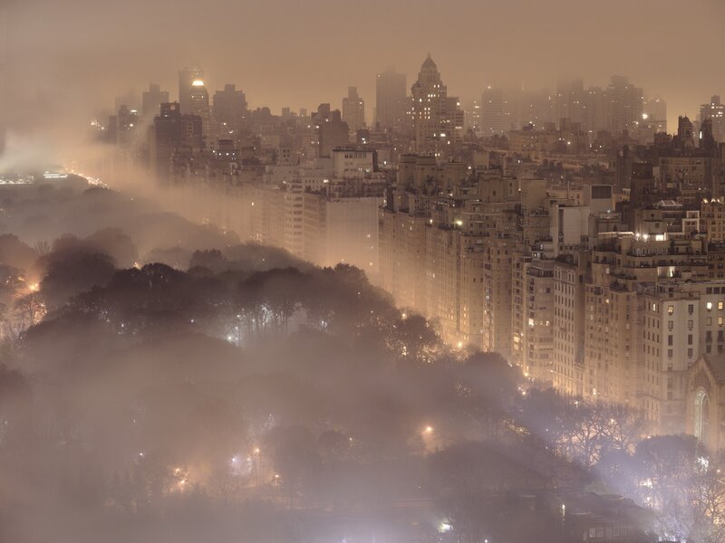 Foggy city skyline at night