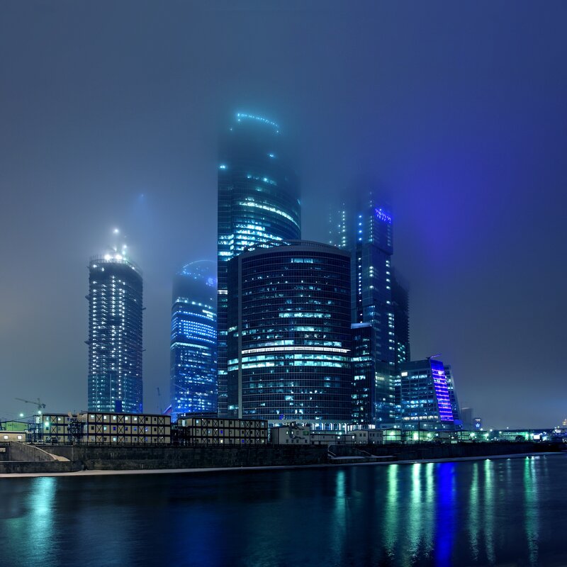 foggy city skyline at night