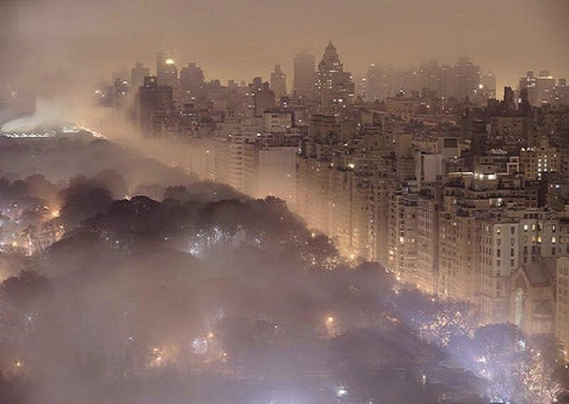 foggy city skyline at night