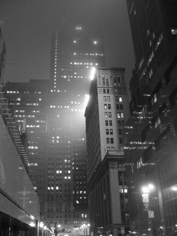 foggy city skyscrapers at night