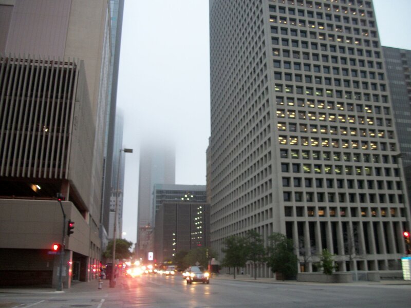 foggy city street with skyscrapers