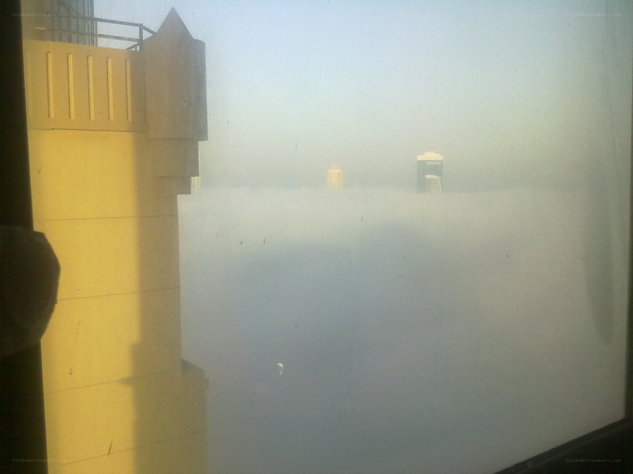 foggy city view from window