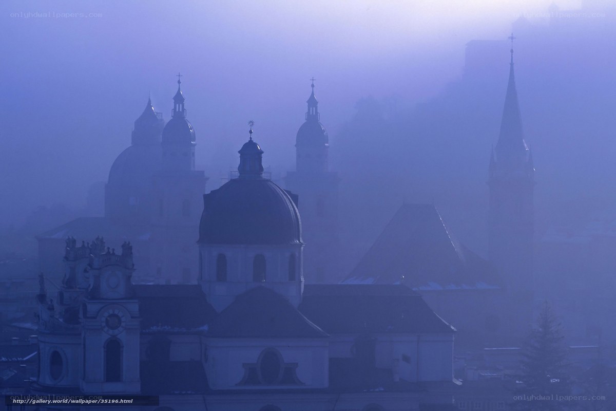 Foggy city with church domes